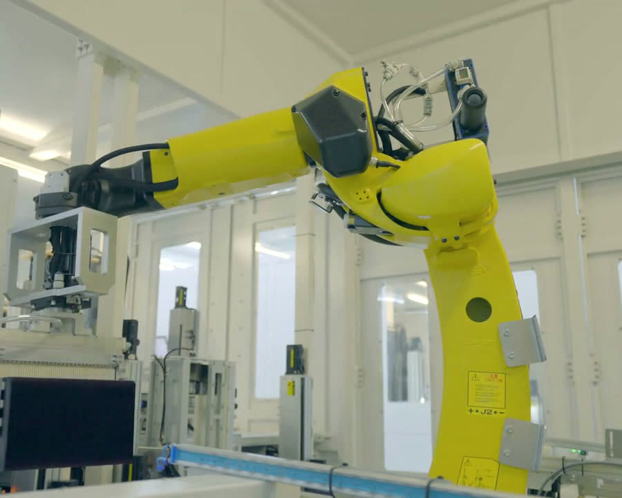 An industrial robot arm at work in a lab